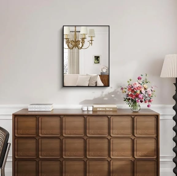 ‎Sleek metal frame, timeless reflection. Add light and space to any room.