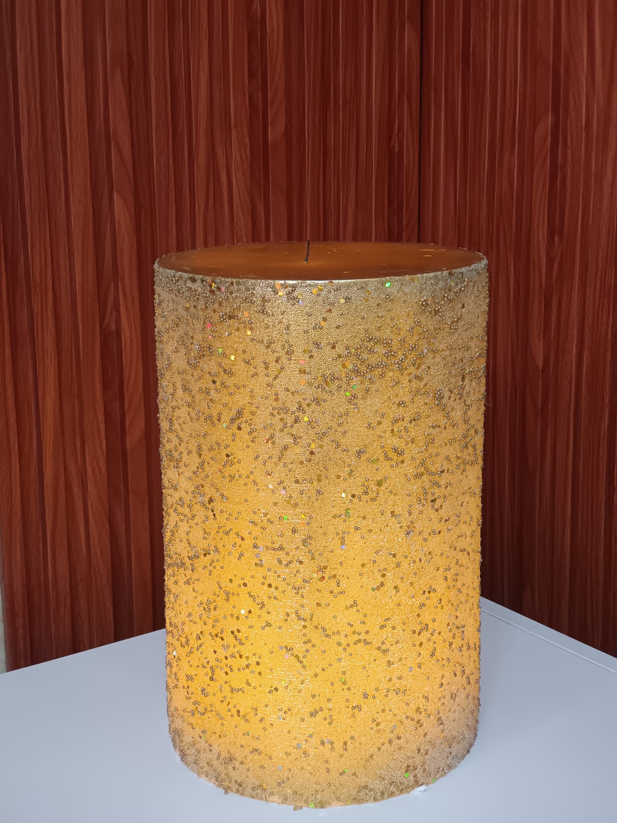 Big gold glitter pillar candle. Perfect for luxury home decor & events.