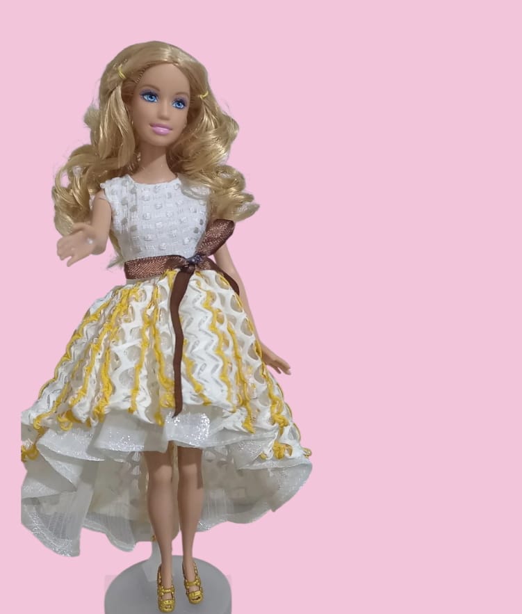 Fashion Girl Doll features long blonde curly hair and blue eyes.