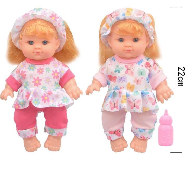 LA NANA TOYS Baby Doll wears cute pajamas and a bonnet.