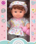 LA NANA TOYS Baby Doll wears cute pajamas and a bonnet.